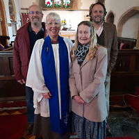 Easter Sunday service. David and Anne Foster pose with churchwardens Hazel and Mike.