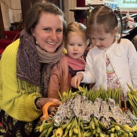 Mothering Sunday service - distribution of flowers by Verity and her children Gabriella and Imogen.